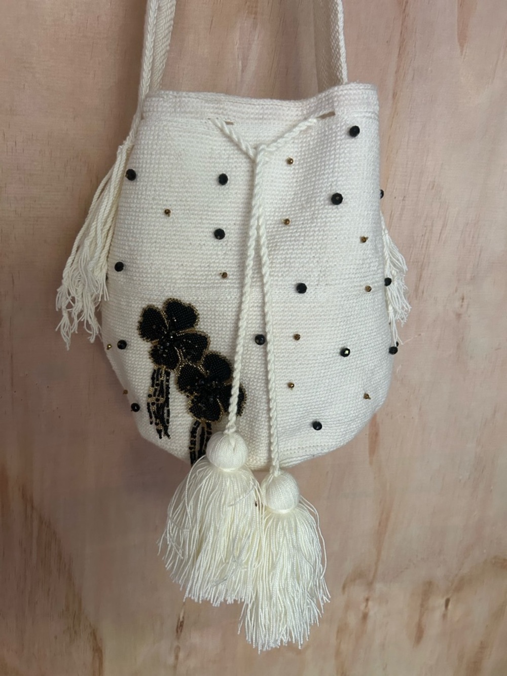 Handwoven Cream Tassel Bucket Bag with Black Bead Floral Detail